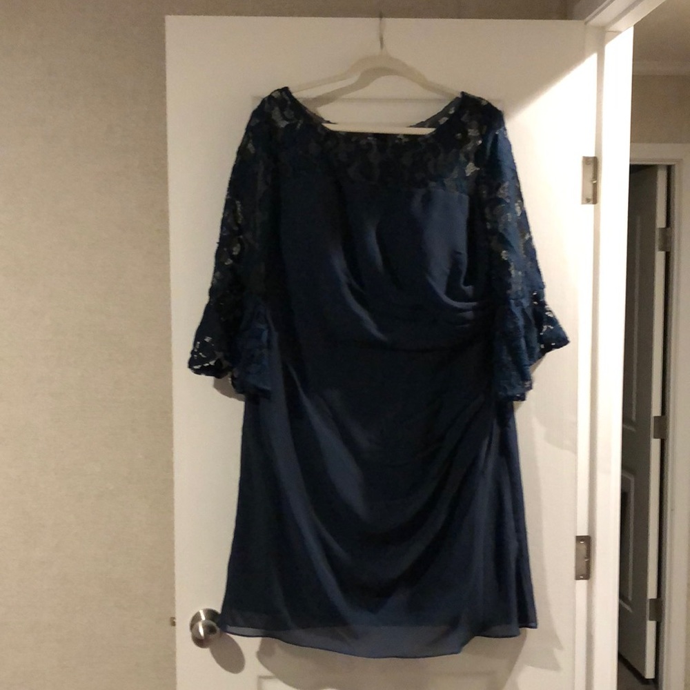 Mediterranean blue short dress with lace sleeves and built in cups.